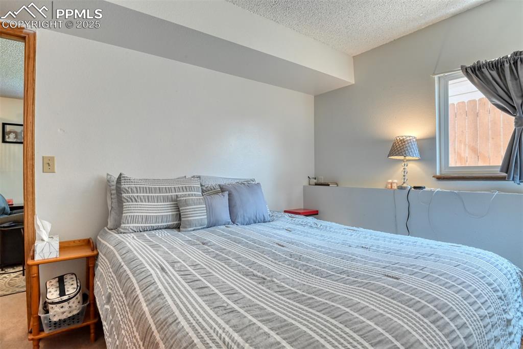 Image 45 of 46: Bedroom featuring a textured ceiling