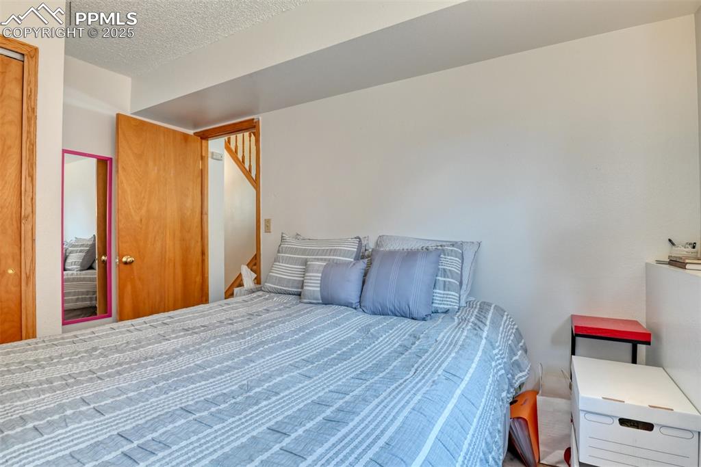 Image 46 of 46: Bedroom with a textured ceiling
