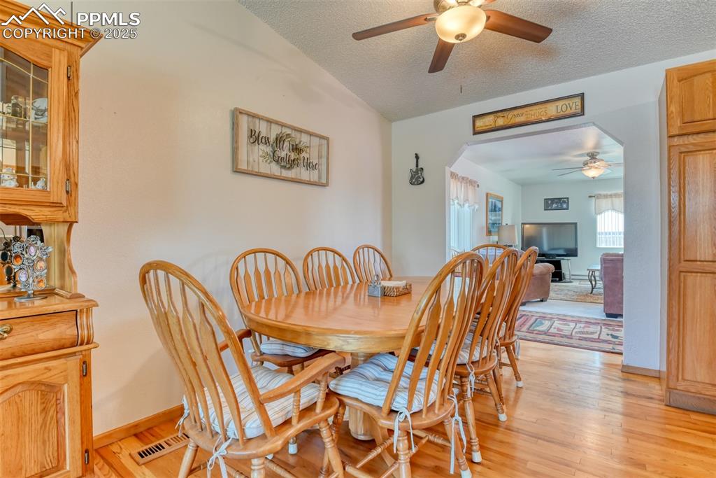 Image 9 of 46: Dining area with ceiling fan