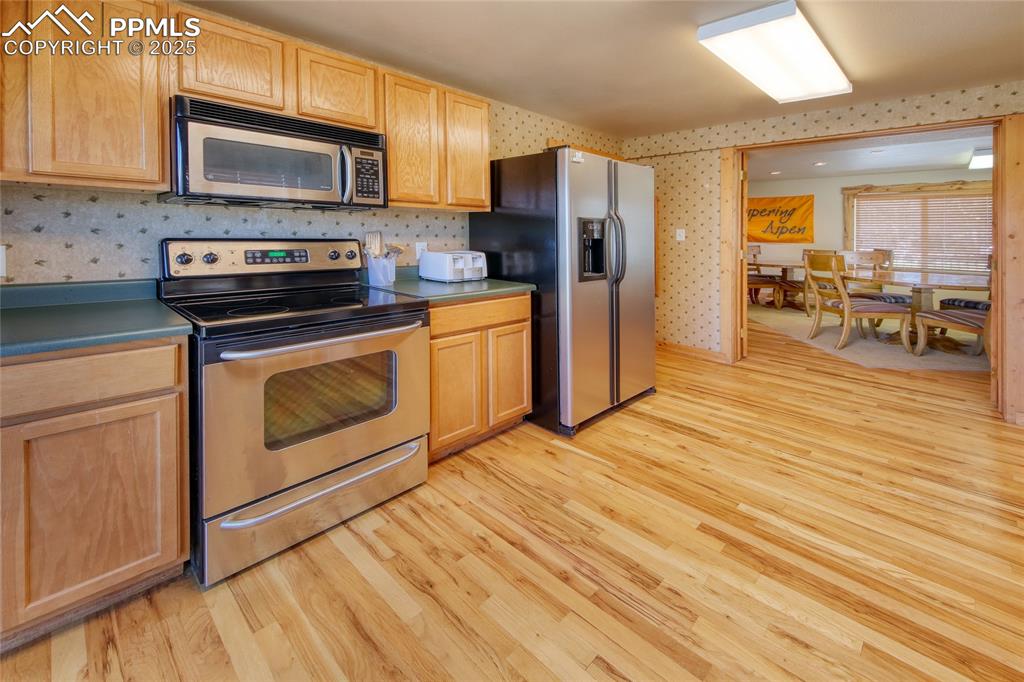 Image 34 of 50: CH Kitchen featuring appliances with stainless steel finishes