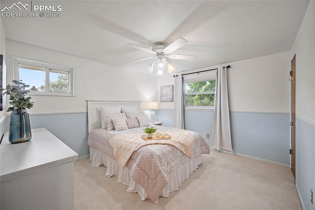 Image 15 of 41: Upstairs primary bedroom with walk-in closet.