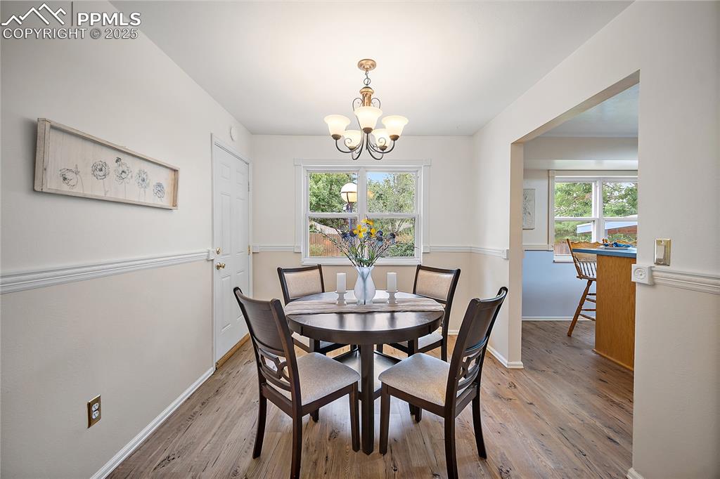 Image 7 of 41: Dining room open to the kitchen and door to the garage. 
