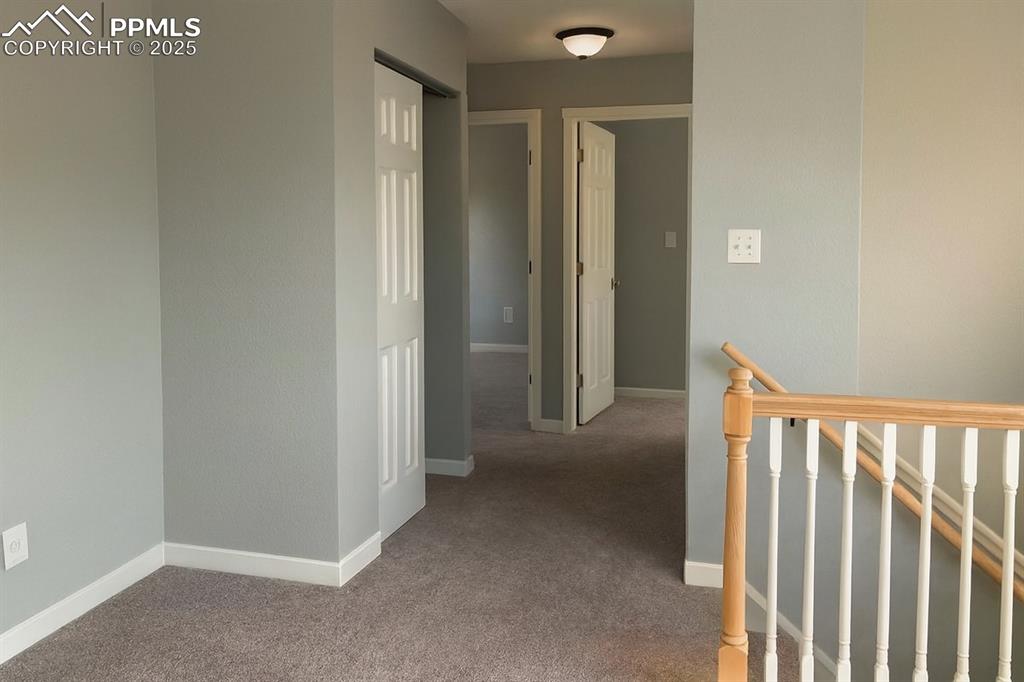Image 6 of 10: Main level hallway to bedrooms