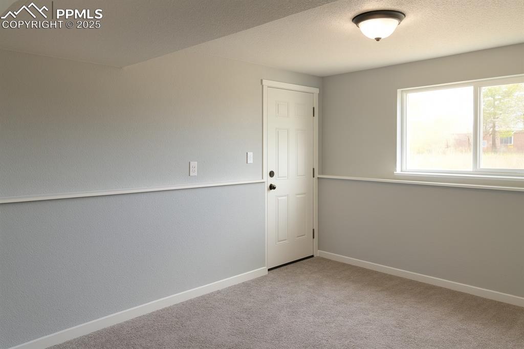 Image 8 of 10: Lower-level family room