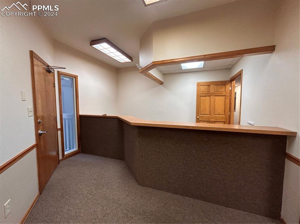 Image 16 of 45: Bar featuring carpet floors