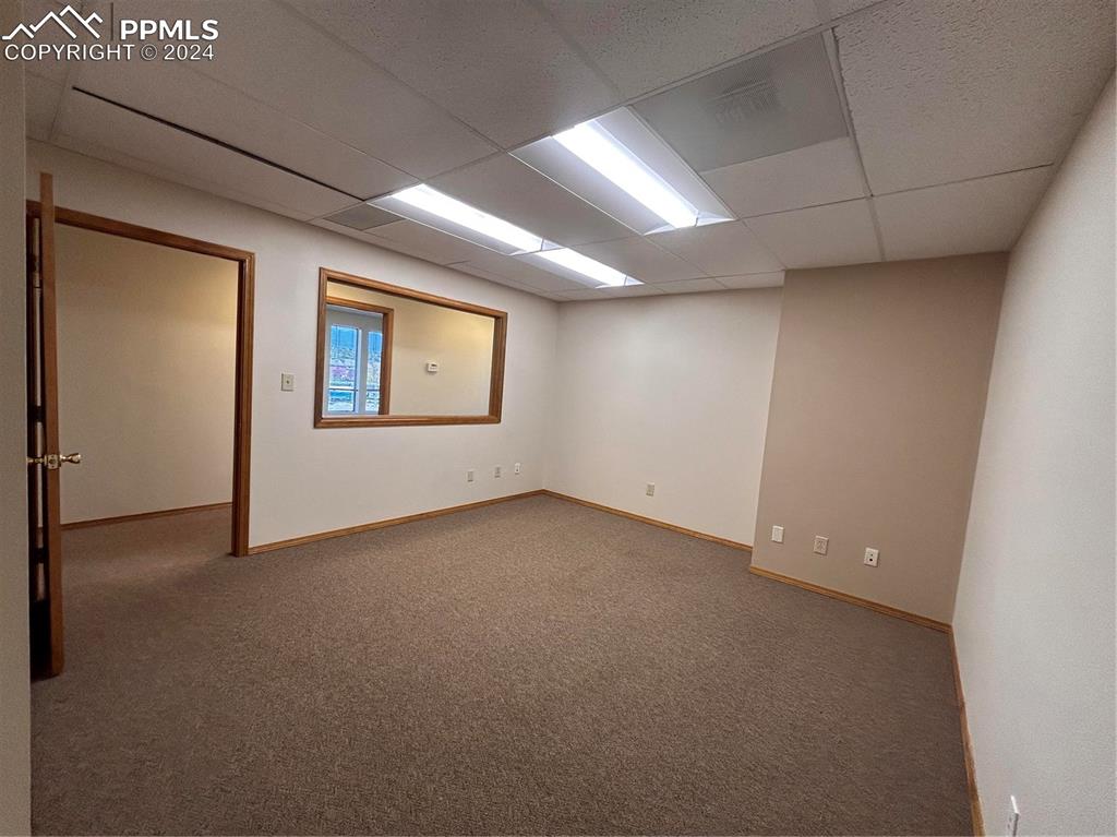 Image 5 of 45: Carpeted spare room featuring a drop ceiling