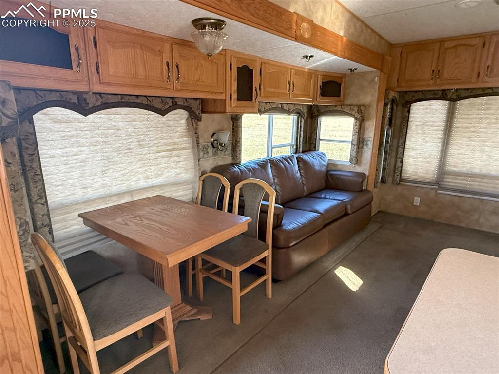 Image 10 of 15: View of carpeted dining room
