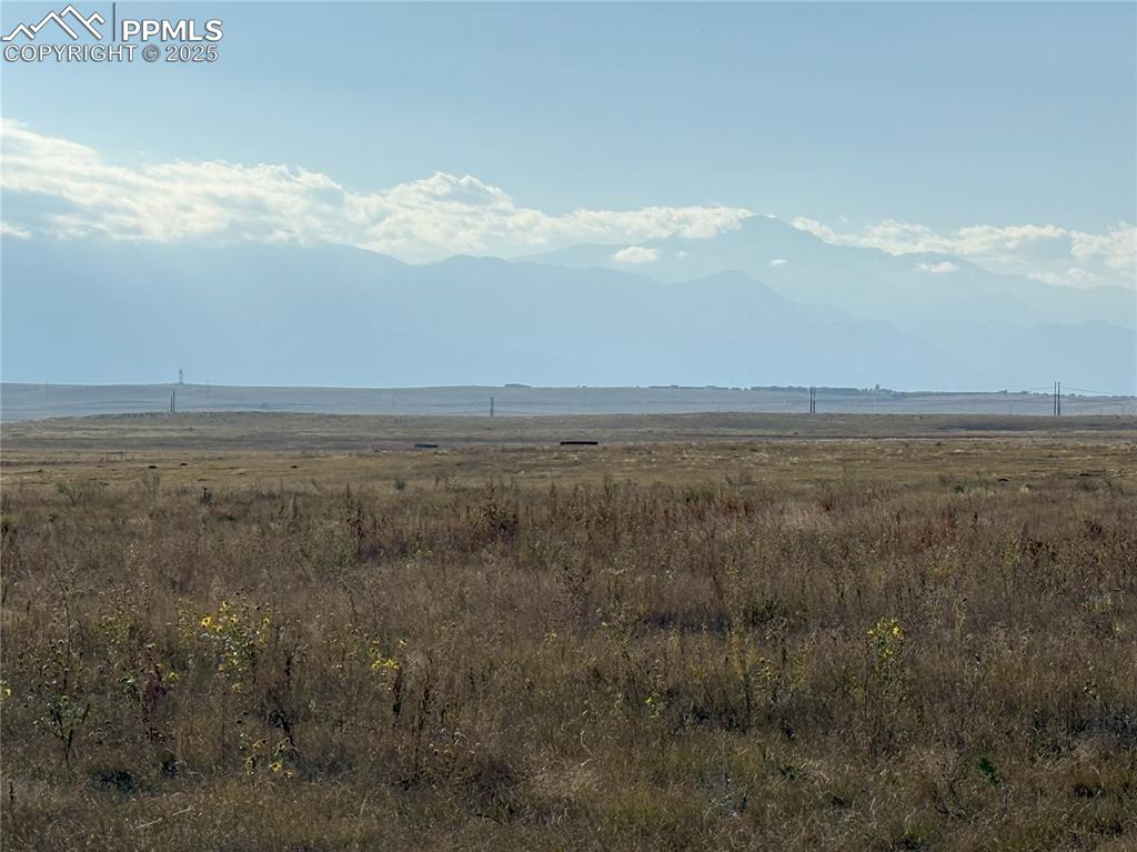 Image 6 of 15: View of mountain backdrop featuring rural landscape