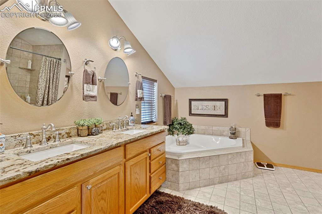 Image 32 of 44: Primary bathroom, 5 pc with double vanities and soaker tub pictured