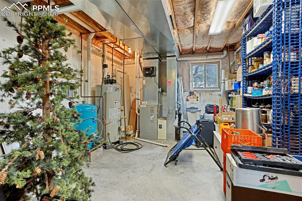 Image 33 of 44: Lower level workshop/storage space