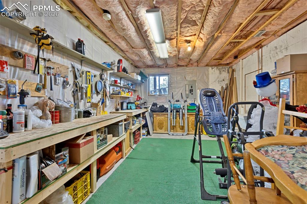 Image 34 of 44: Lower level workshop/storage space