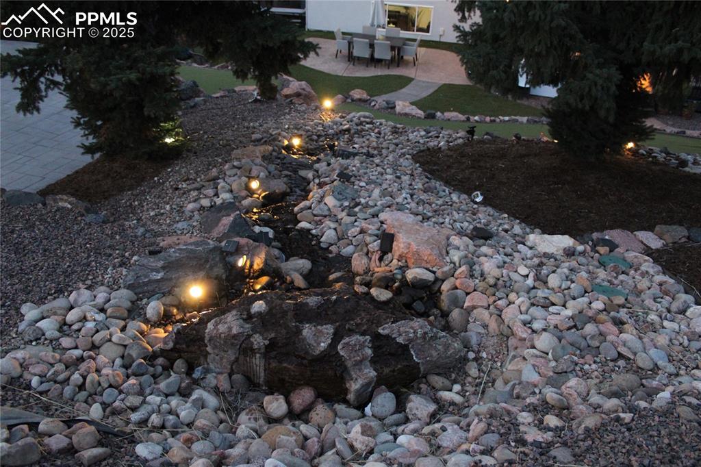 Image 21 of 26: View of yard featuring a patio