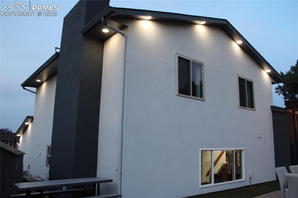 Image 3 of 26: Rear view of house with stucco siding
