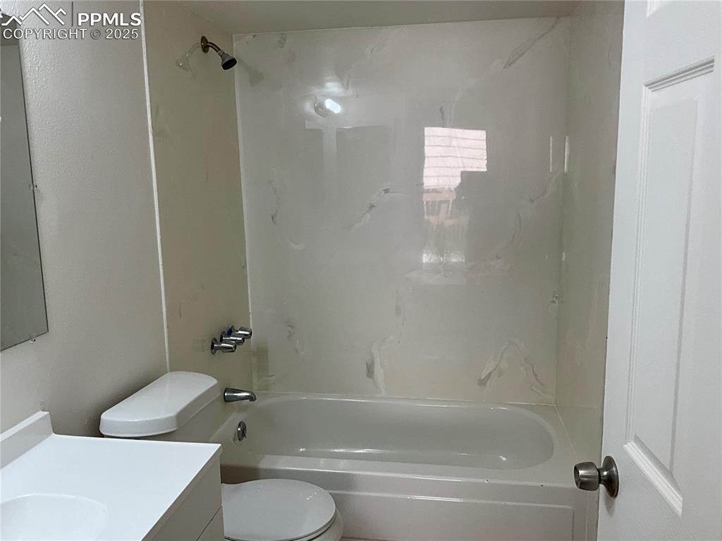 Image 9 of 13: Full bath featuring vanity and shower / washtub combination