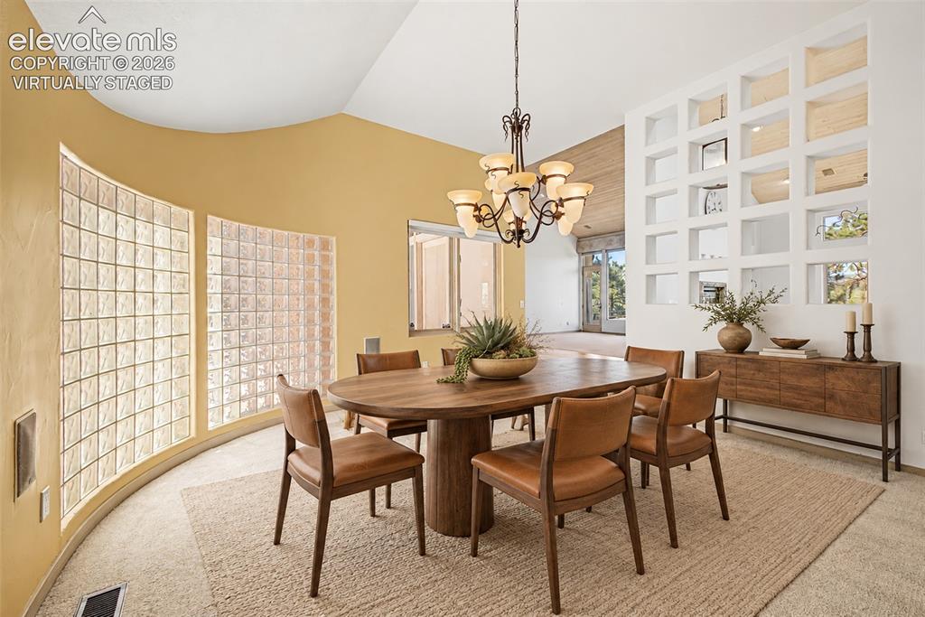 Image 12 of 50: Virtually Staged
Curved wall with glass block windows, vaulted ceiling, de