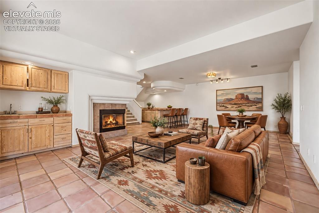 Image 34 of 50: Virtually Staged
Terracotta tile flooring, stone-clad fireplace, integrate
