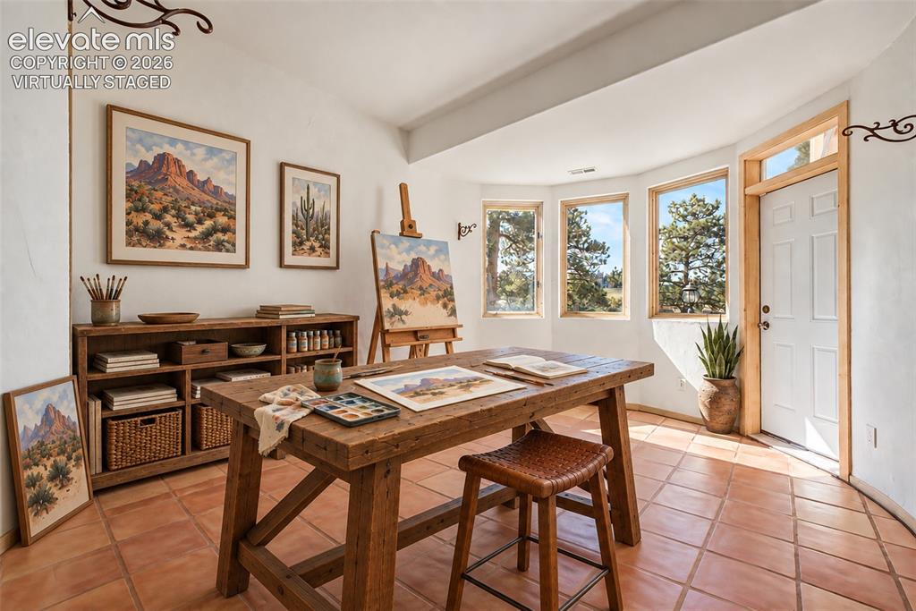 Image 43 of 50: Virtually Staged
Warm terracotta tile flooring, a built-in wooden shelving