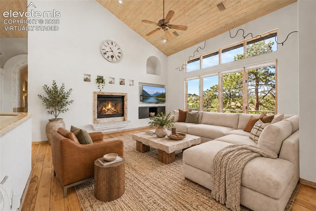 Image 7 of 50: Virtually Staged
Vaulted wood-paneled ceiling with a ceiling fan, a stone 