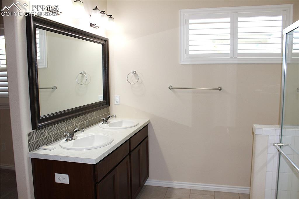 Image 21 of 46: Primary Bathroom with Double Sinks
