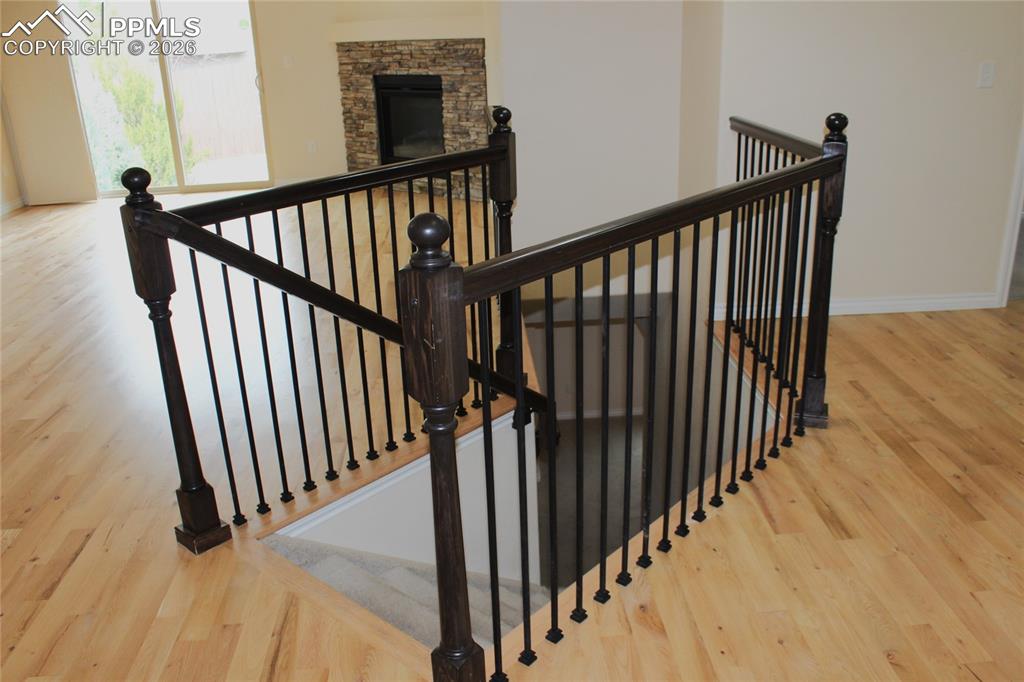 Image 8 of 46: Wrought Iron Balusters with Stained Rails