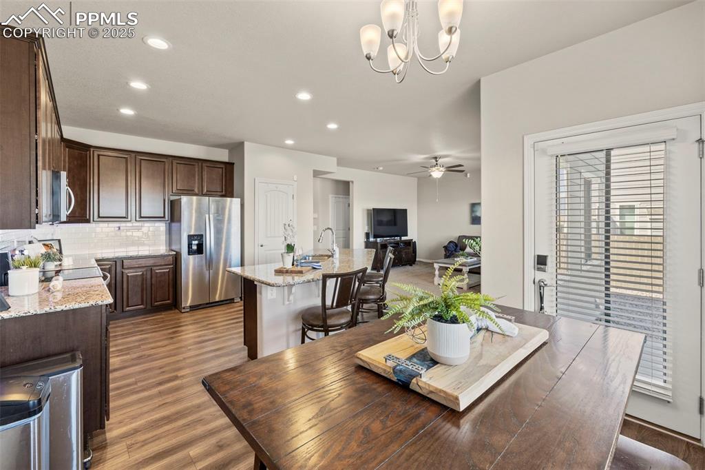 Image 14 of 36: Dining space featuring recessed lighting, wood finished floors, and ceiling