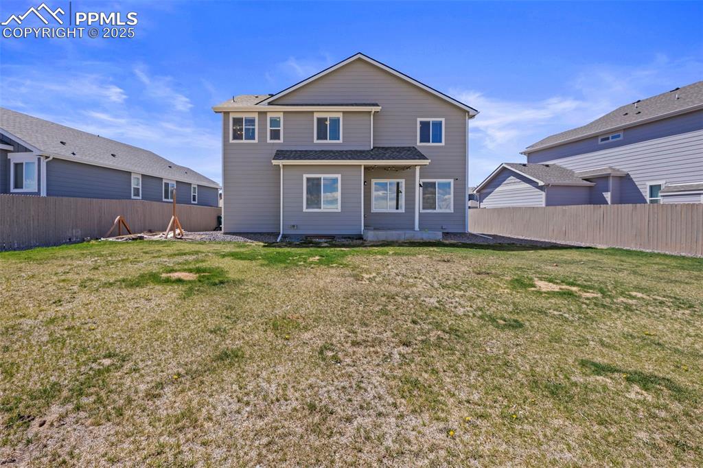 Image 33 of 36: Fenced in backyard with privacy and mountain views