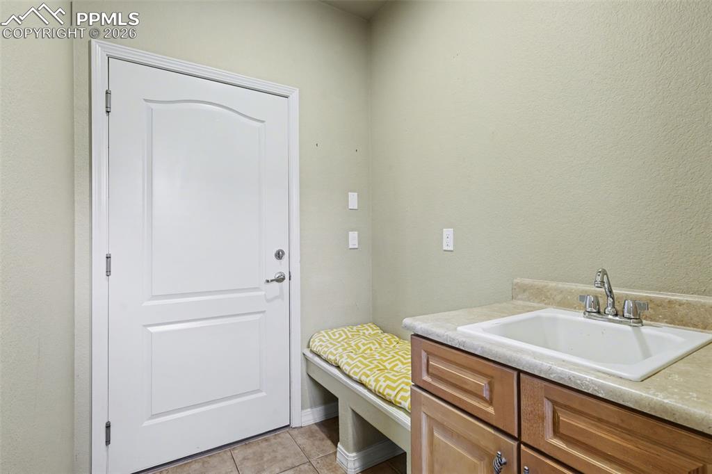 Image 18 of 49: Private Entry Off Garage