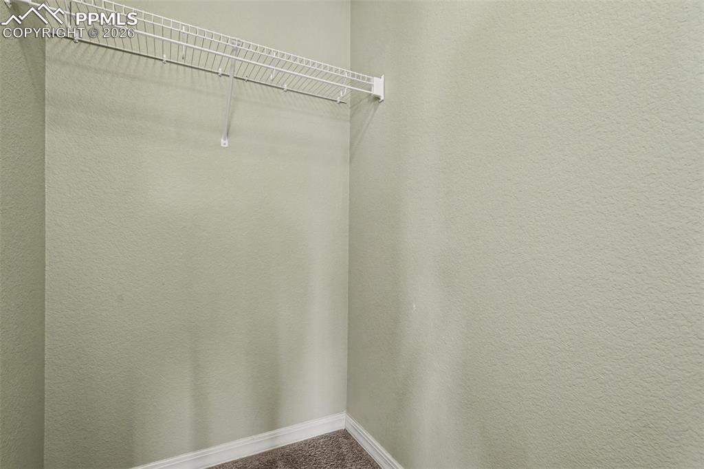 Image 31 of 49: 2nd Bedroom Walk-in Closet