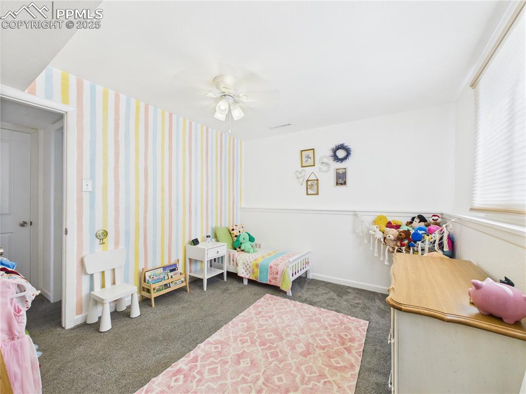 Image 27 of 41: Bedroom with carpet and ceiling fan