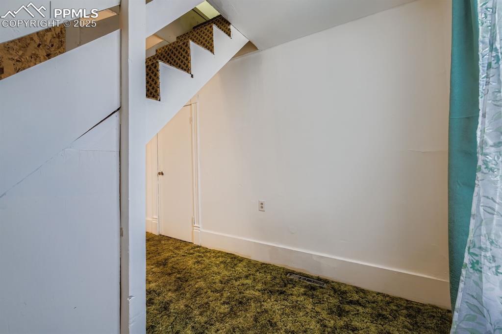 Image 22 of 28: Empty room featuring carpet flooring