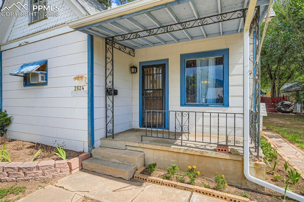 Image 4 of 28: Entrance to property with a porch