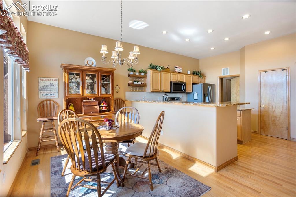 Image 12 of 33: Enjoy family meals or entertain friends in this generously sized informal d