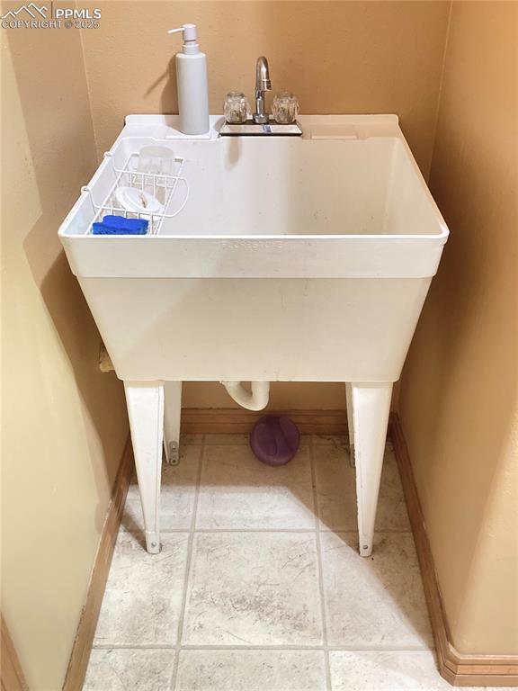 Image 16 of 33: YES, there is a utility sink in the laundry room!