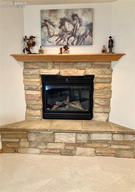 Image 21 of 33: Cuddle up in front of a warm fire in the basement family room on those cold
