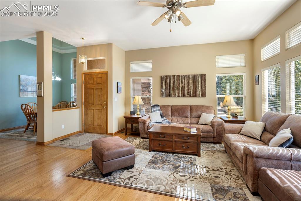 Image 4 of 33: The tiled entry opens to a lovely 
great room awash in natural light.