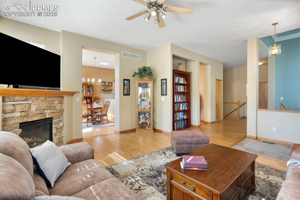 Image 8 of 33: Main level great room grants entry to the informal dining area and the left