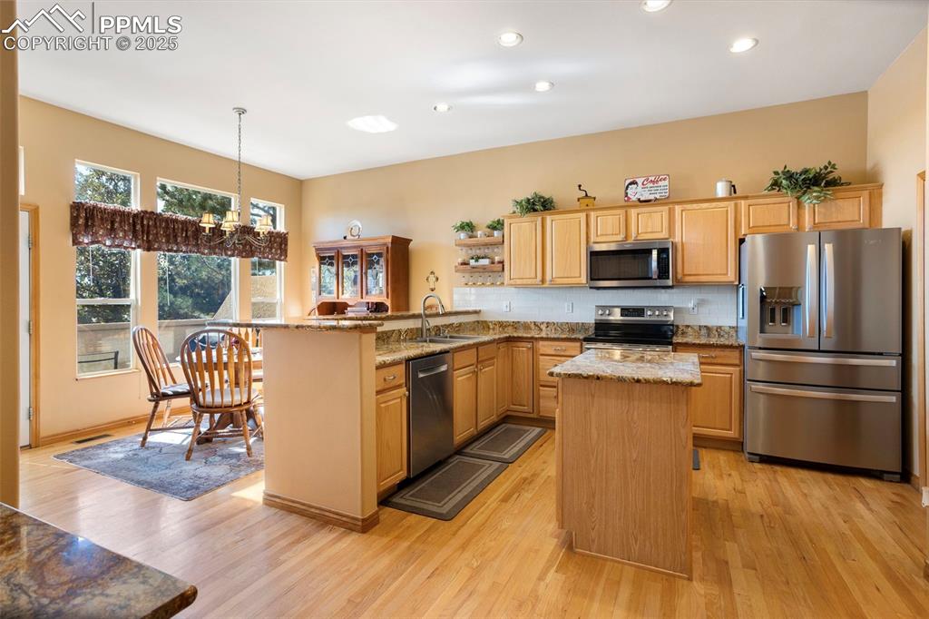 Image 9 of 33: This eat-in country kitchen is a chef