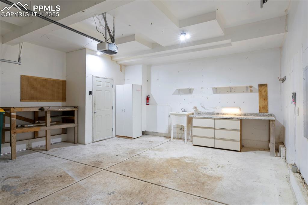 Image 27 of 35: Garage with a garage door opener