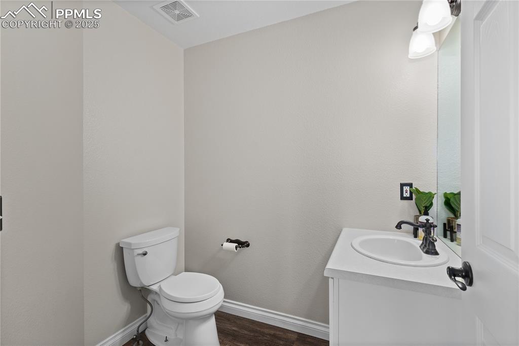 Image 15 of 31: Bathroom featuring vanity and wood finished floors
