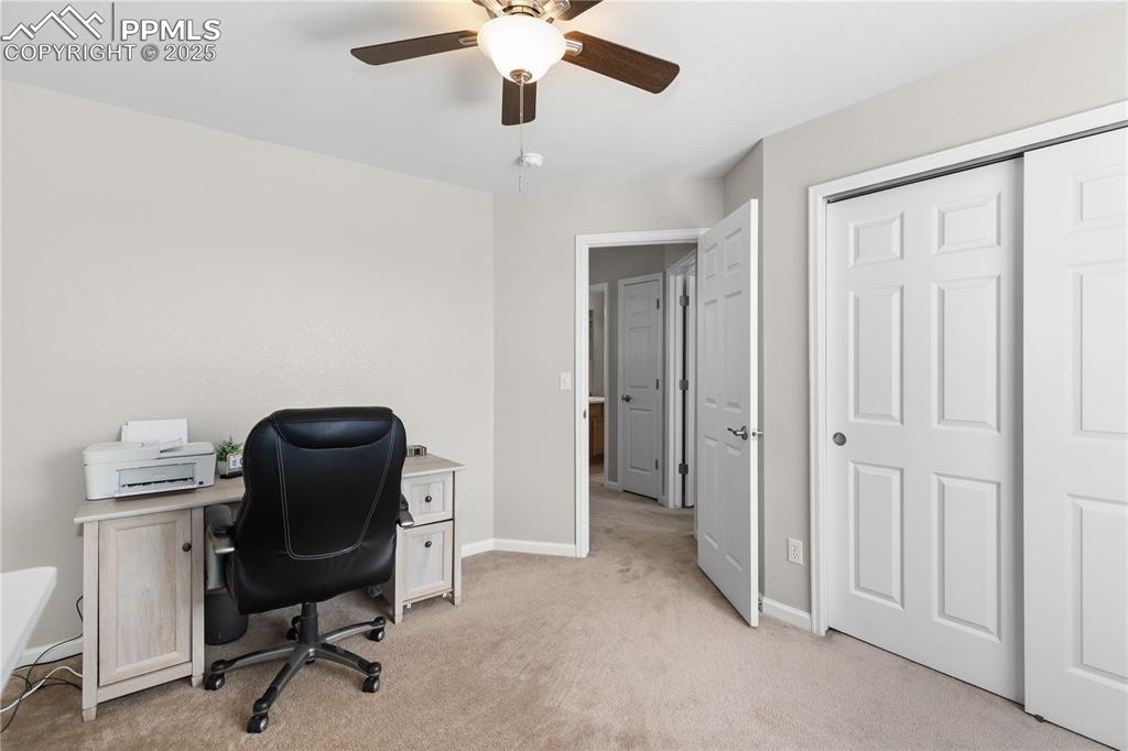 Image 20 of 31: Office featuring a ceiling fan and light carpet