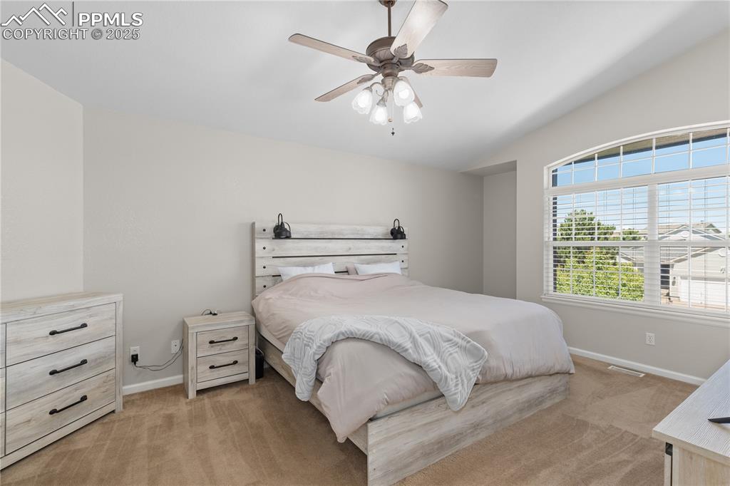 Image 23 of 31: Bedroom with light carpet and ceiling fan