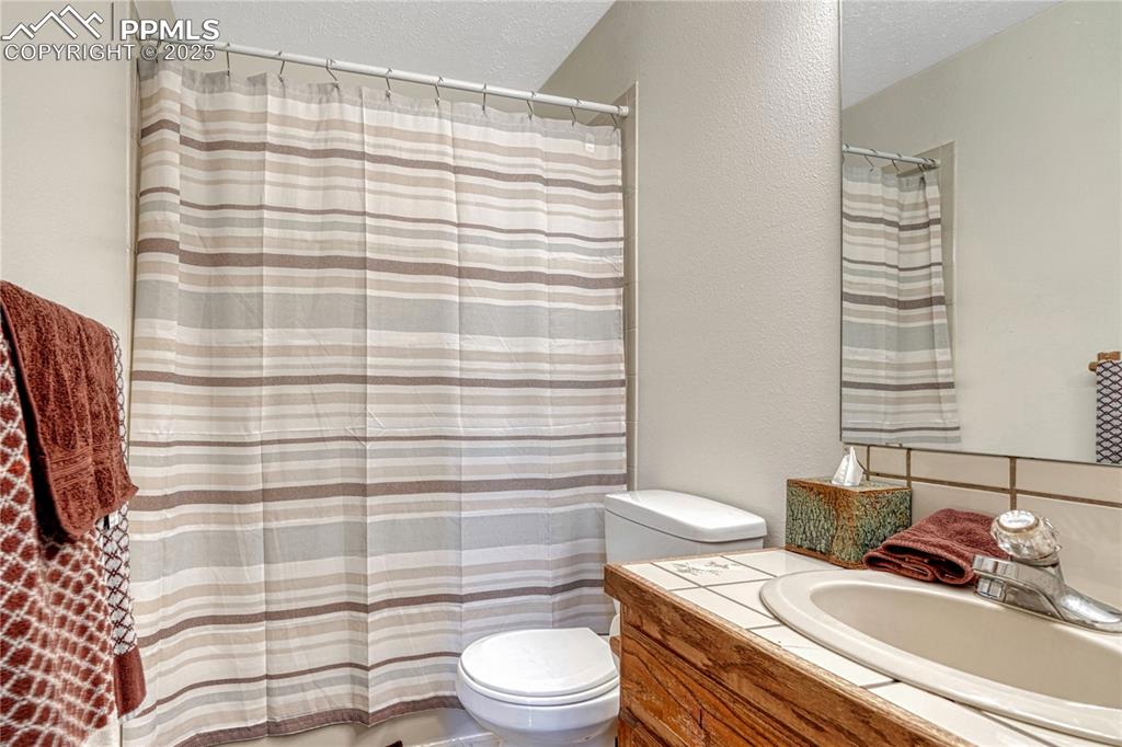 Image 18 of 48: main level bathroom