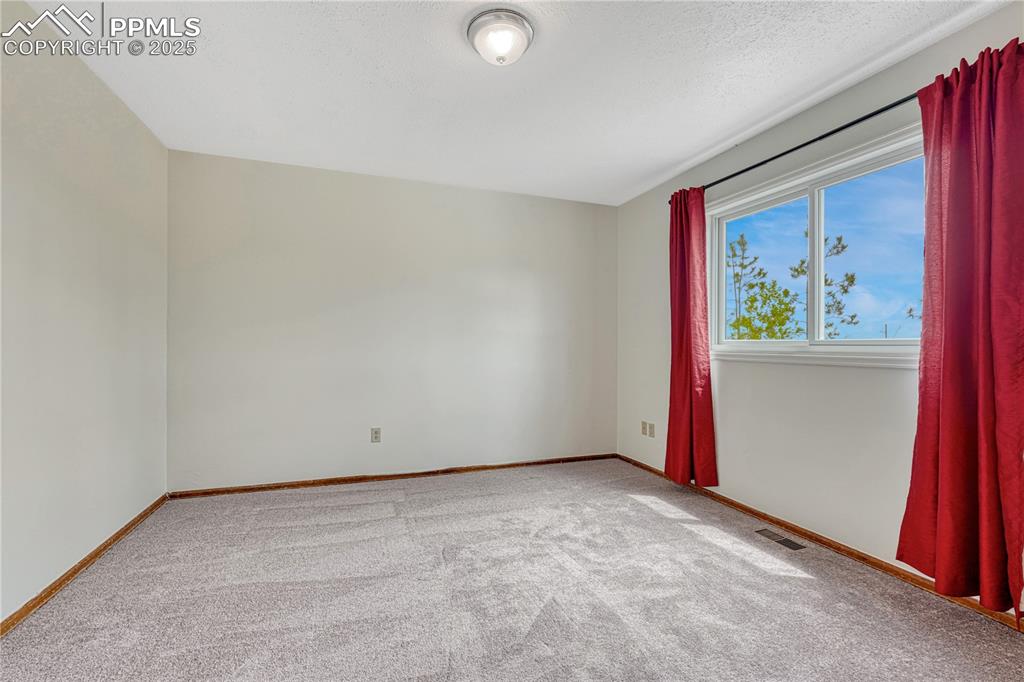 Image 19 of 48: main level bedroom