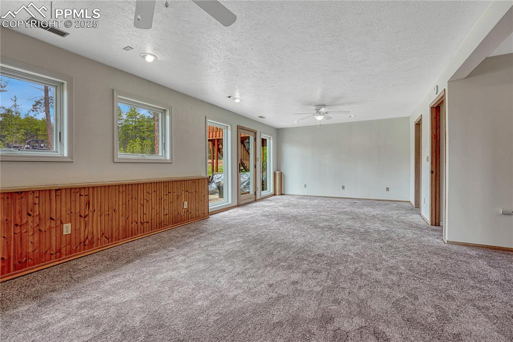 Image 23 of 48: Basement family room with walk-out