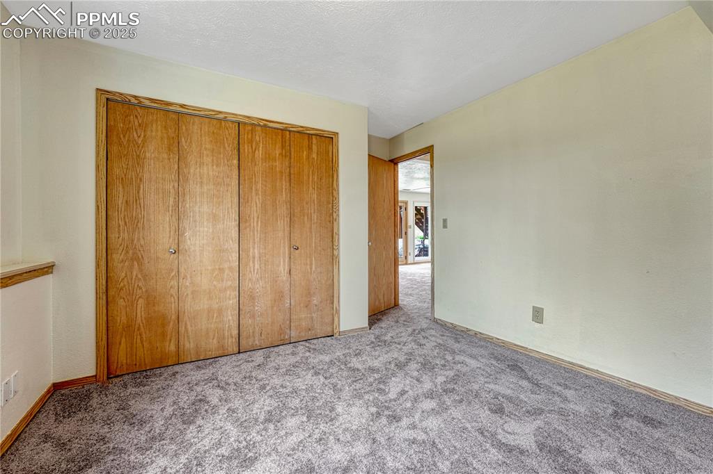 Image 26 of 48: Basement bedroom, new carpets