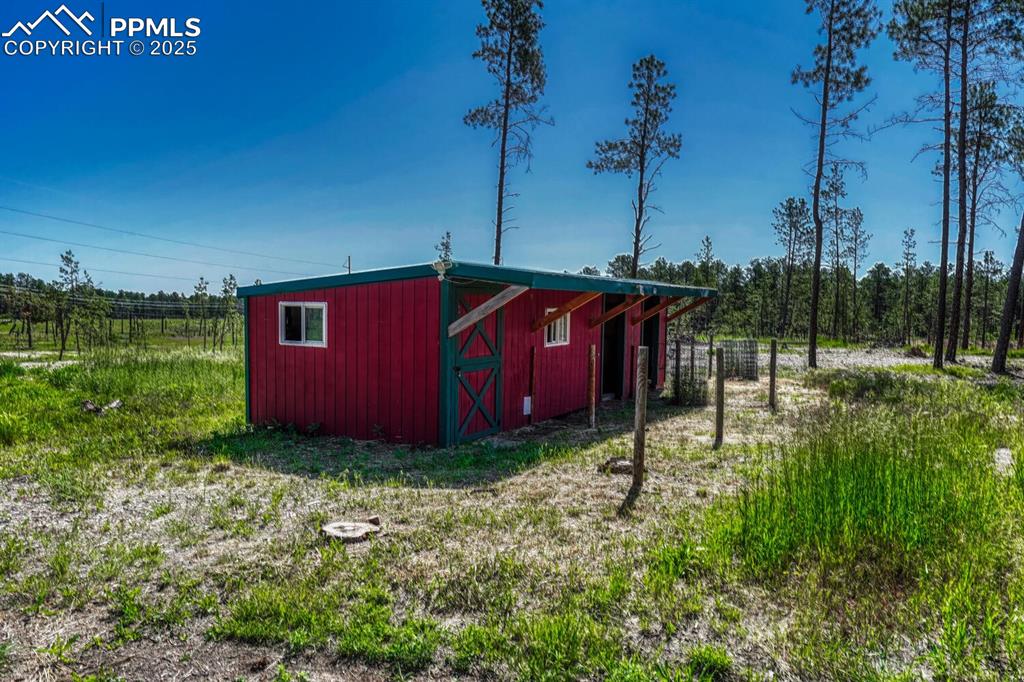 Image 36 of 48: Barn with stalls and storage