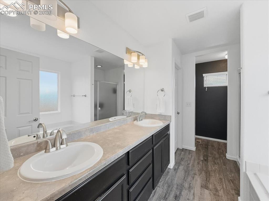 Image 18 of 38: Master bathroom upper level