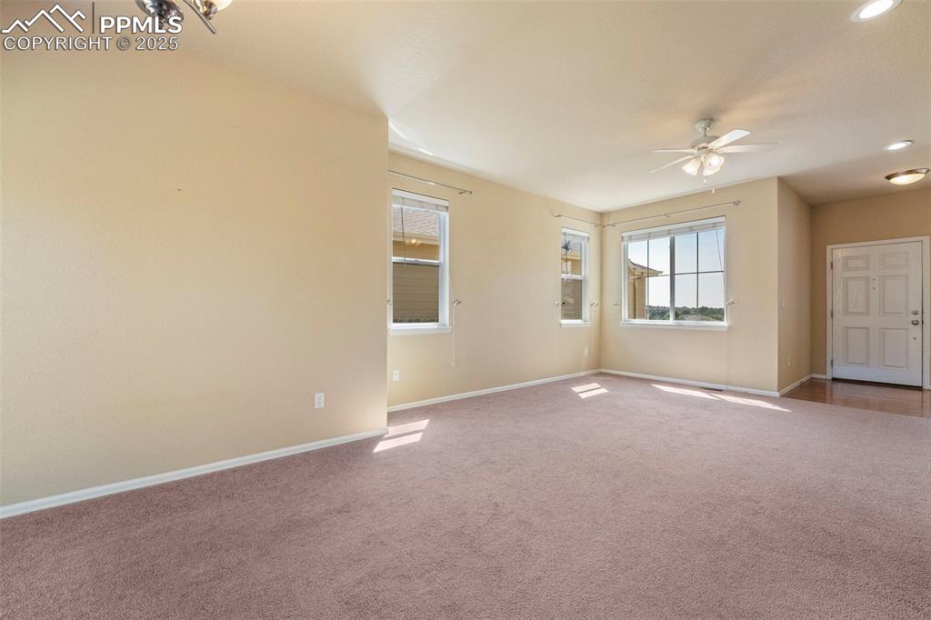 Image 11 of 49: Carpeted spare room featuring ceiling fan and recessed lighting