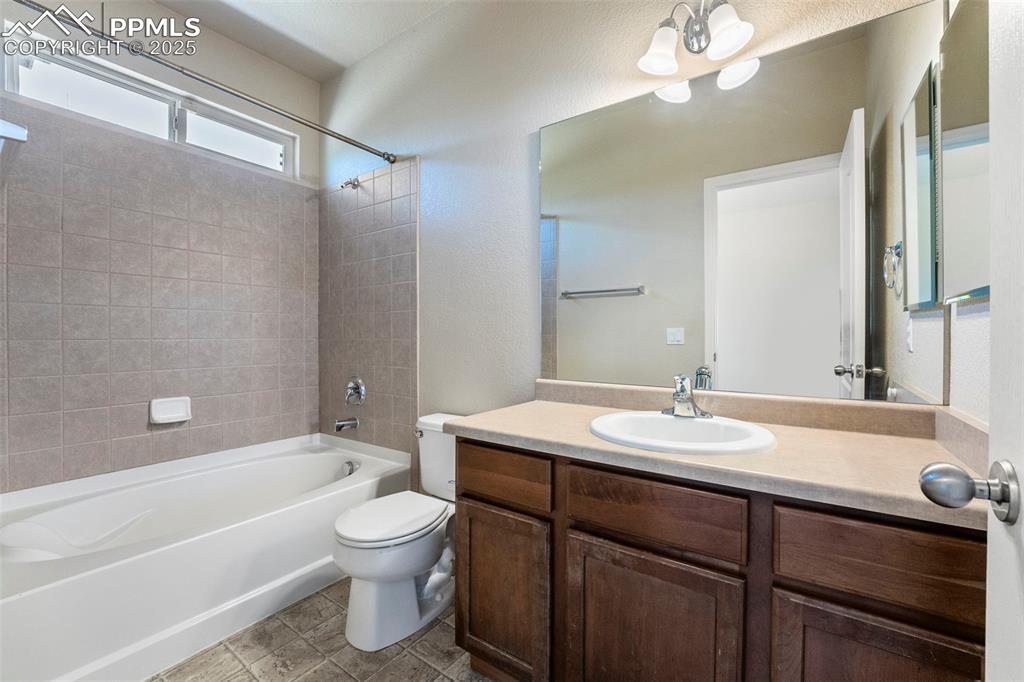 Image 19 of 49: Full bathroom with shower / tub combination and vanity