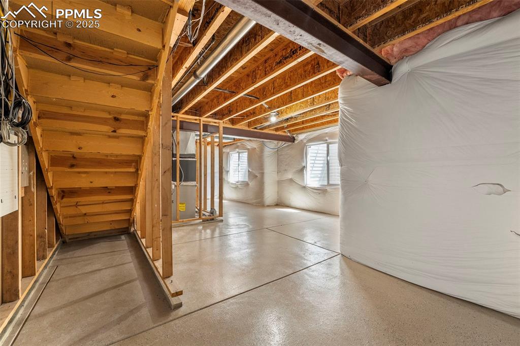 Image 31 of 49: Basement with heating unit
